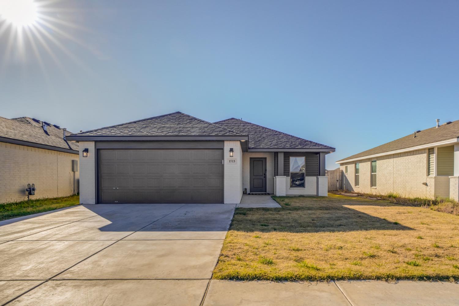 a front view of a house with yard