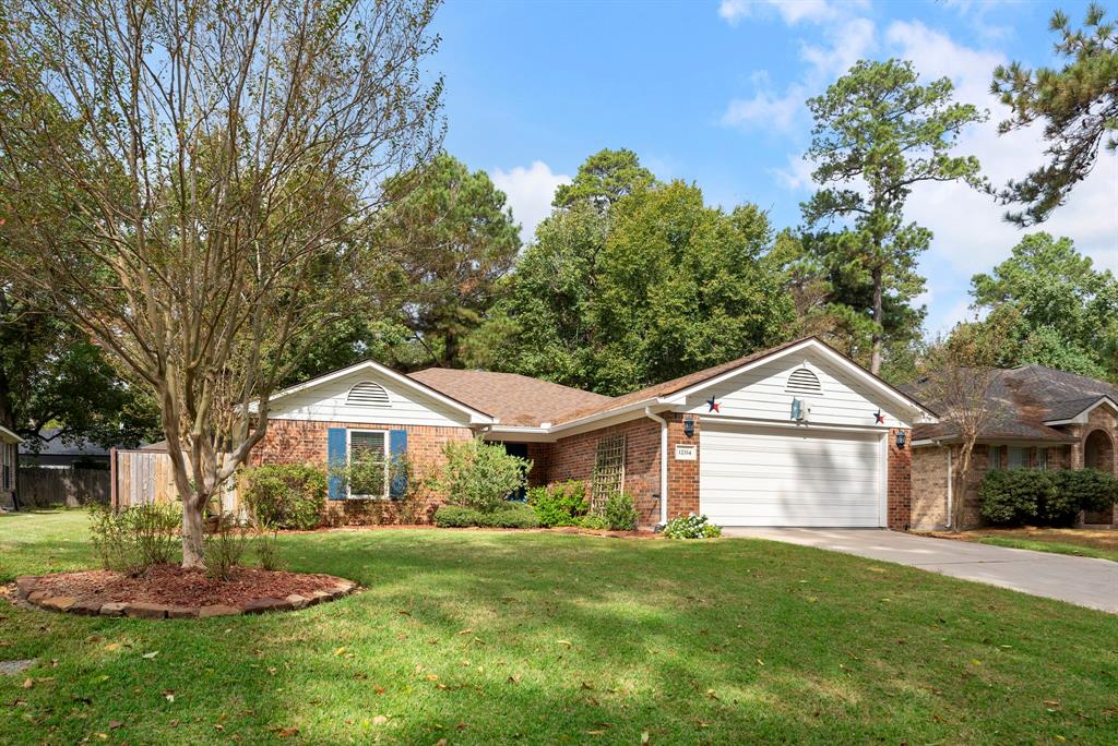 This red brick one-story home is in the sought-after community of Walden on Lake Conroe!