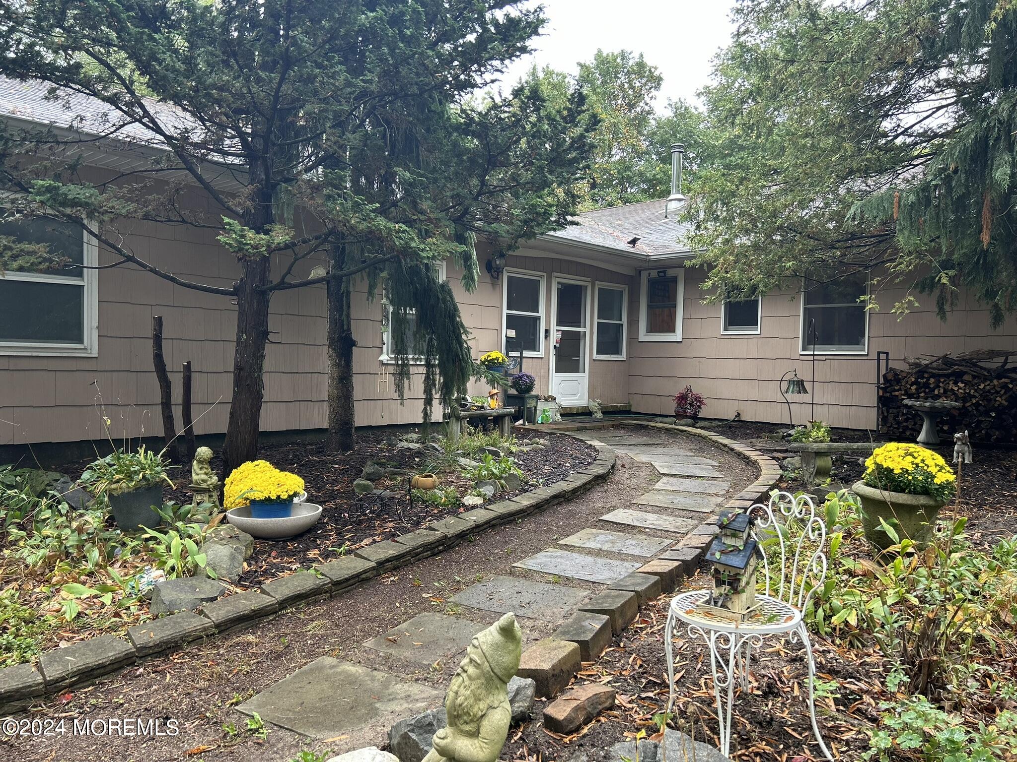 a front view of house with yard and seating area