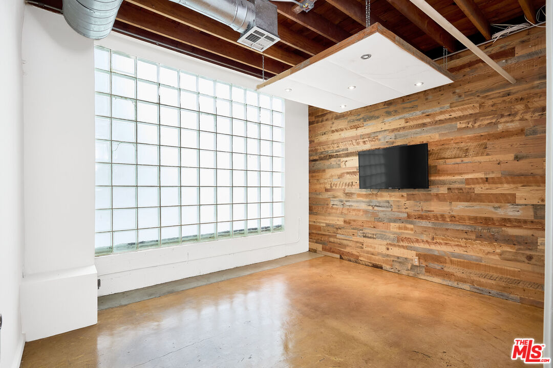 a view of an empty room and a fireplace