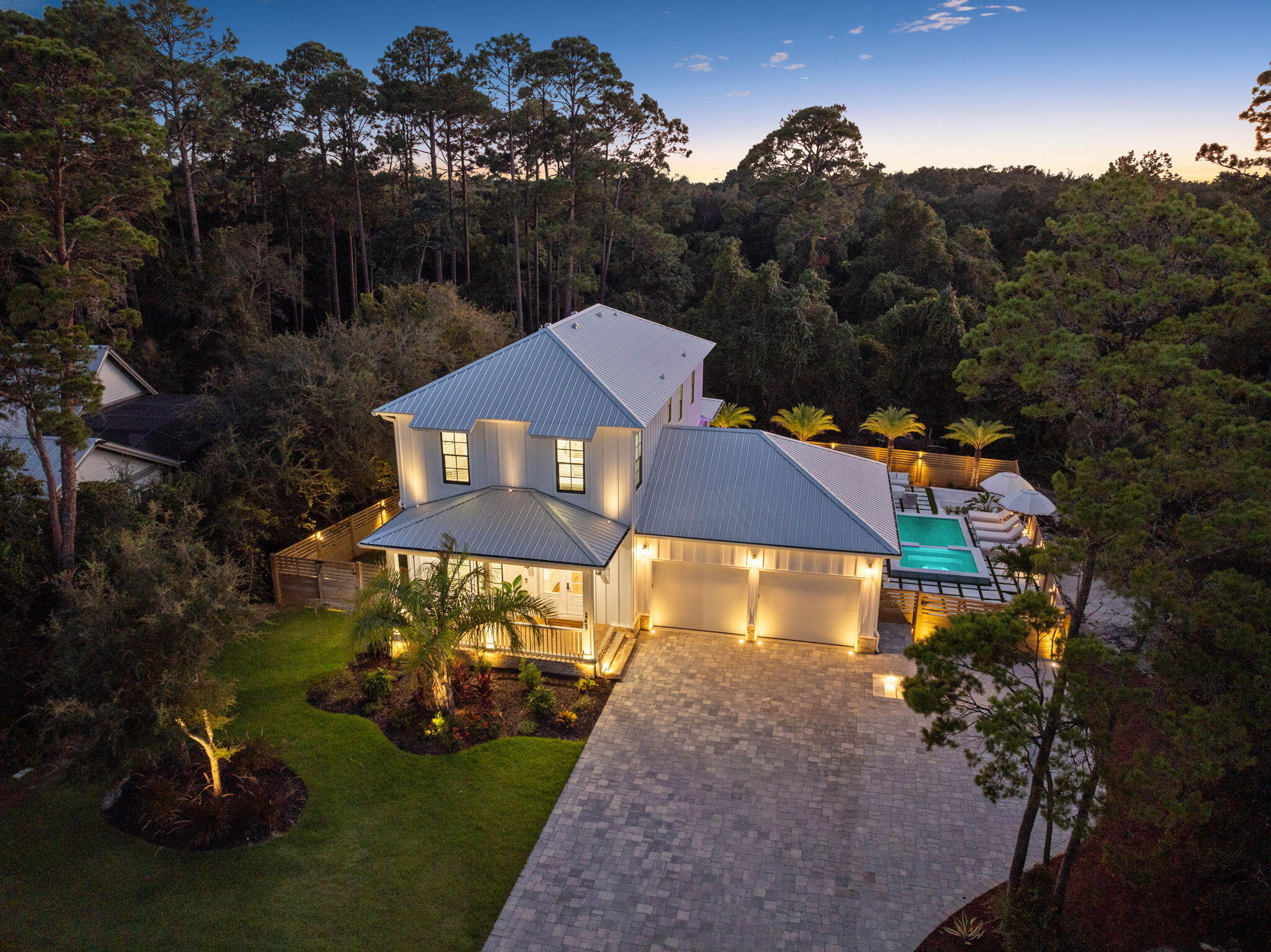 an aerial view of a house with garden space and street view