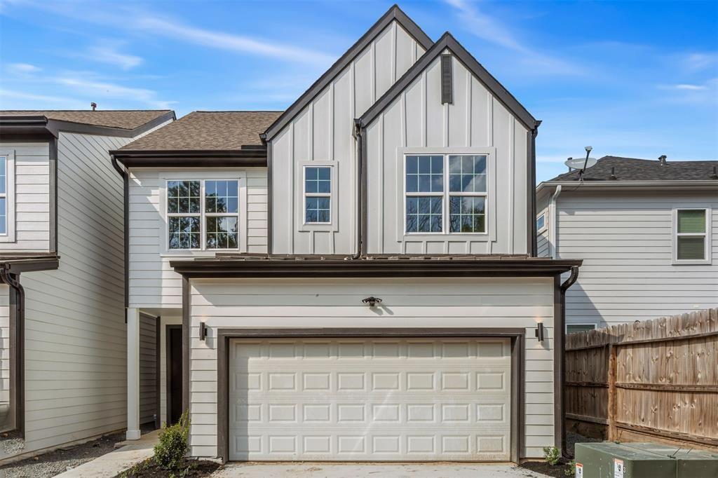 a front view of a house with a garage