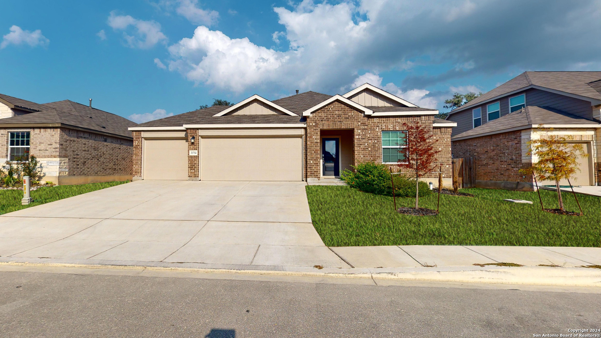 a front view of a house with yard