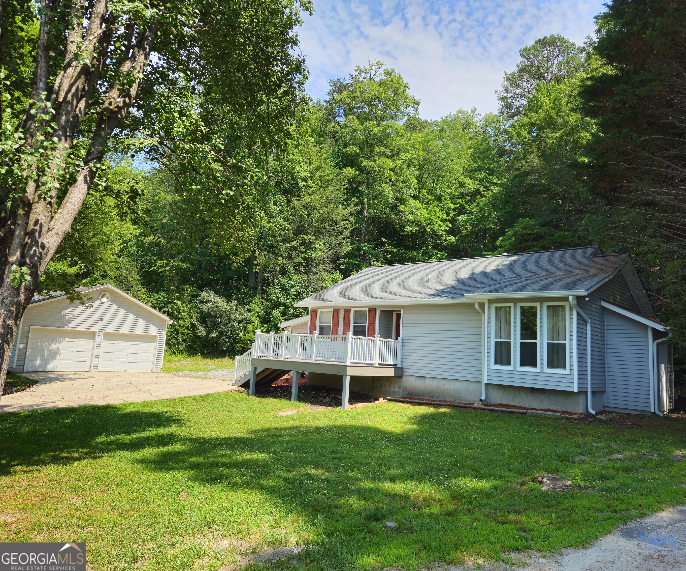 a house view with a garden space