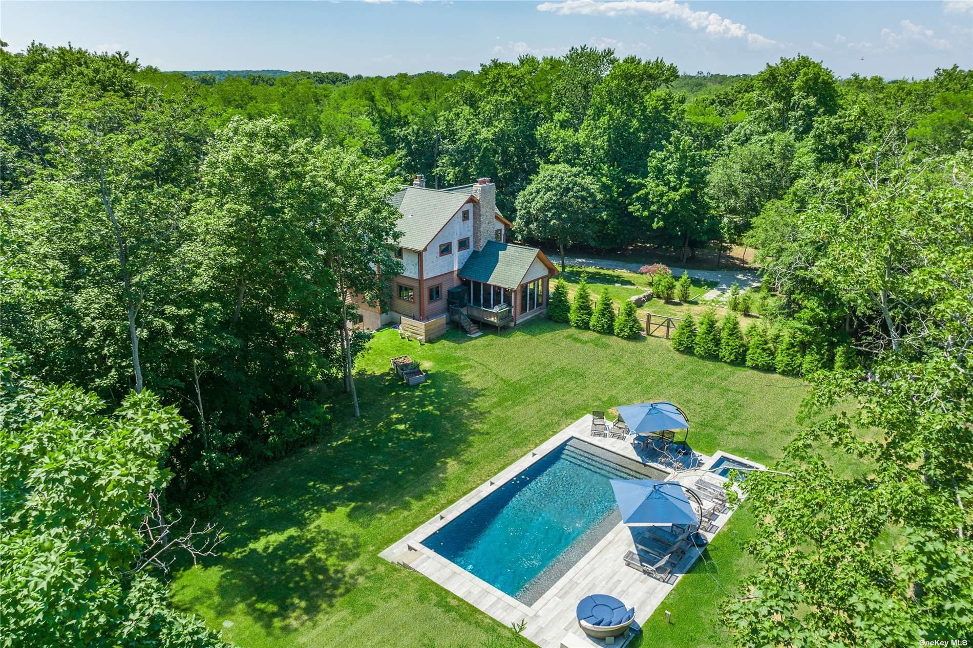 a view of an house with a big yard