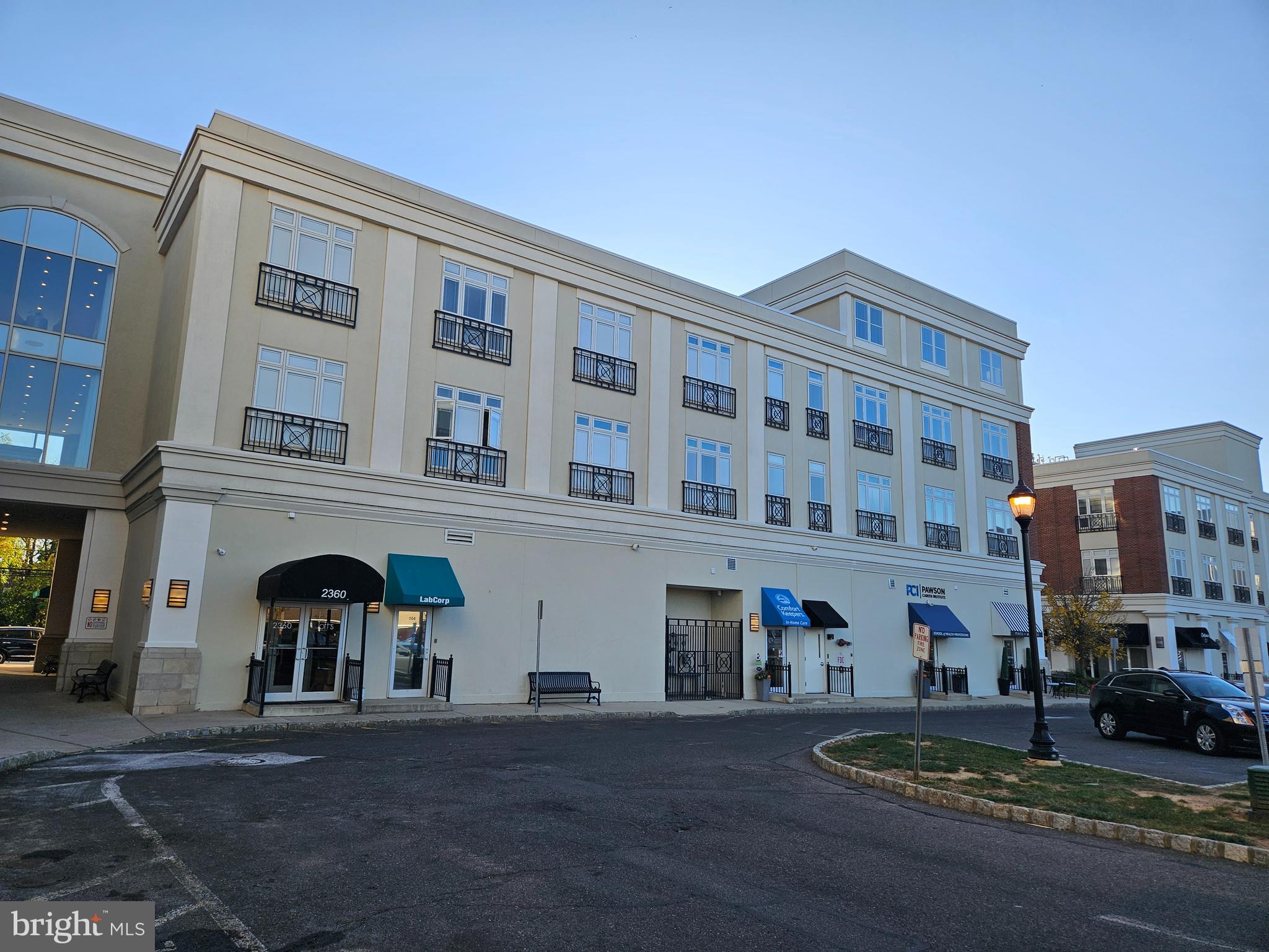 a front view of a building with lot of windows