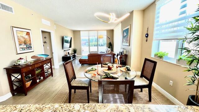 a dining room with furniture and wooden floor