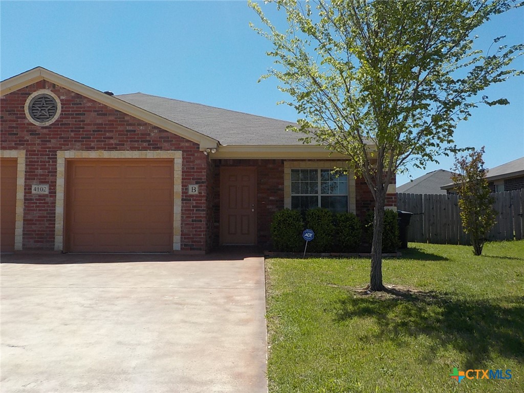 a front view of house with yard