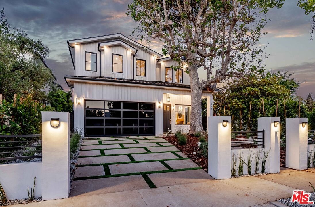 a front view of a house with a garage