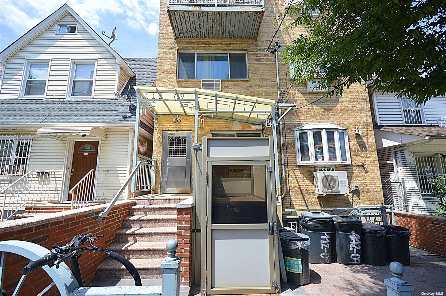 a front view of a house with balcony