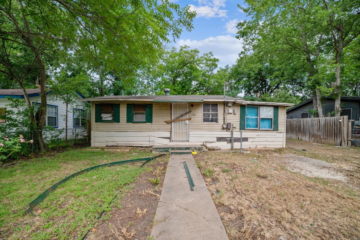 a front view of house with yard patio and green space