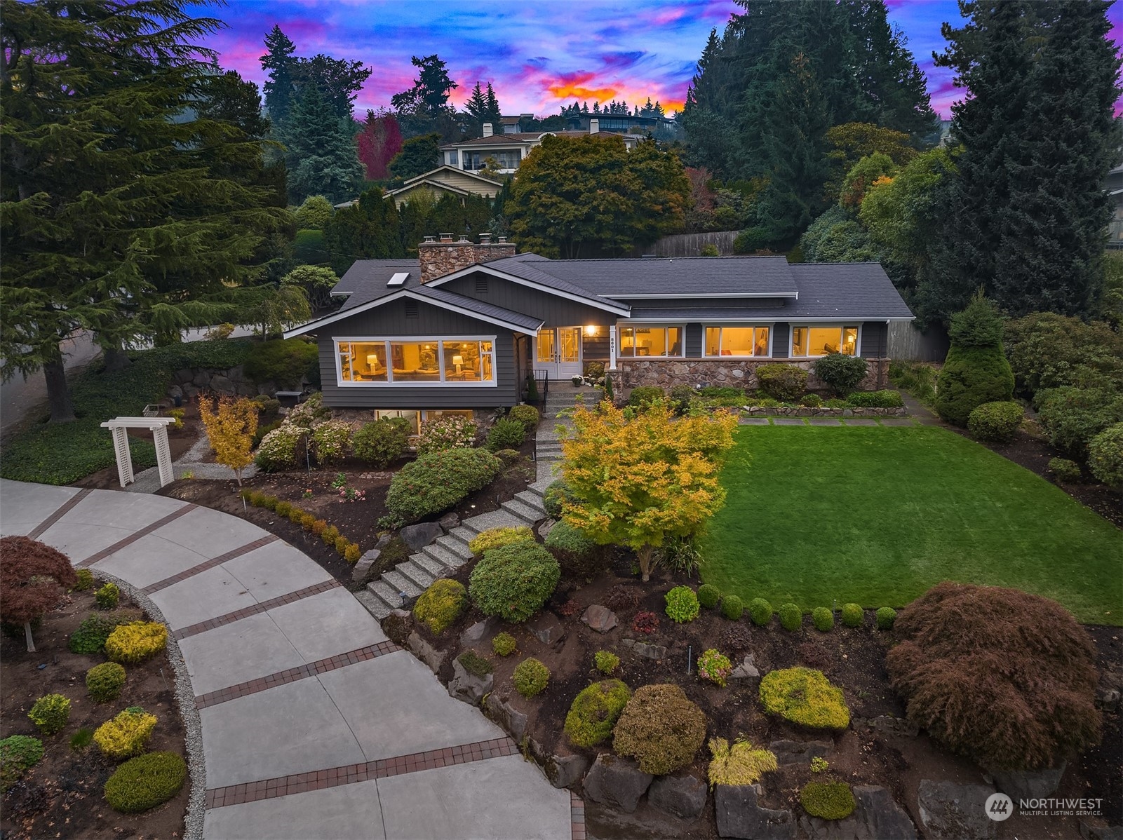 a front view of a house with a garden