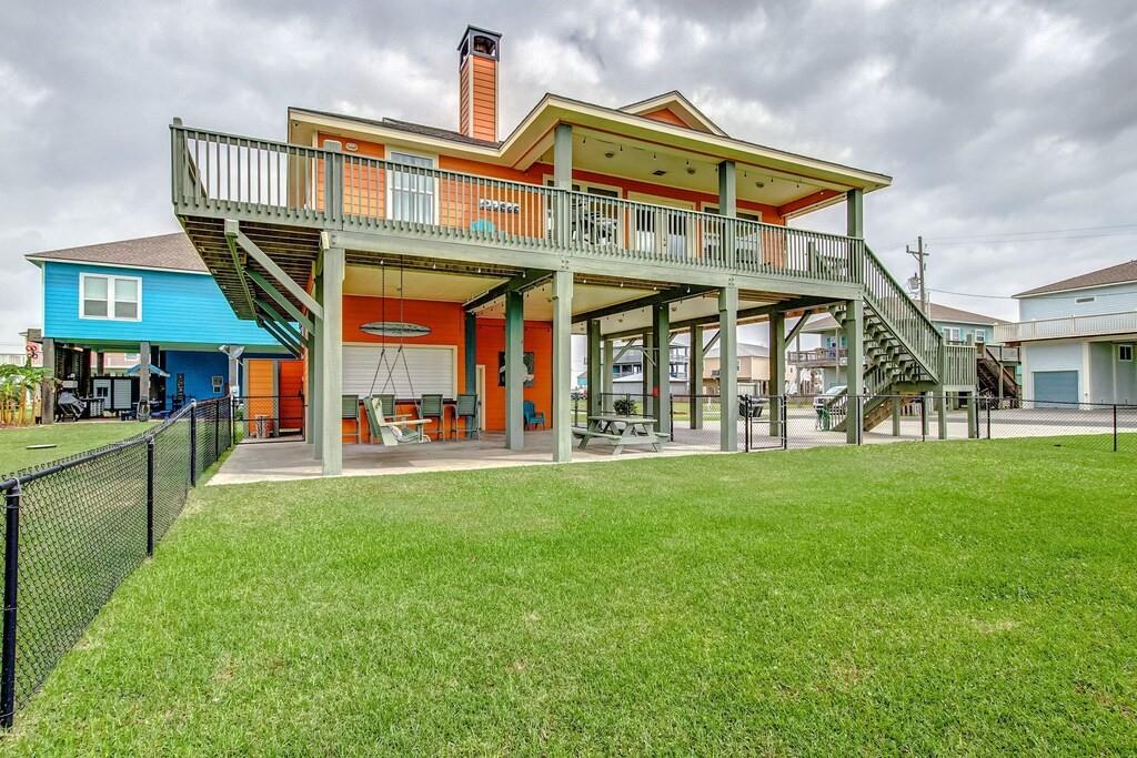 a front view of a house with a yard table and chairs