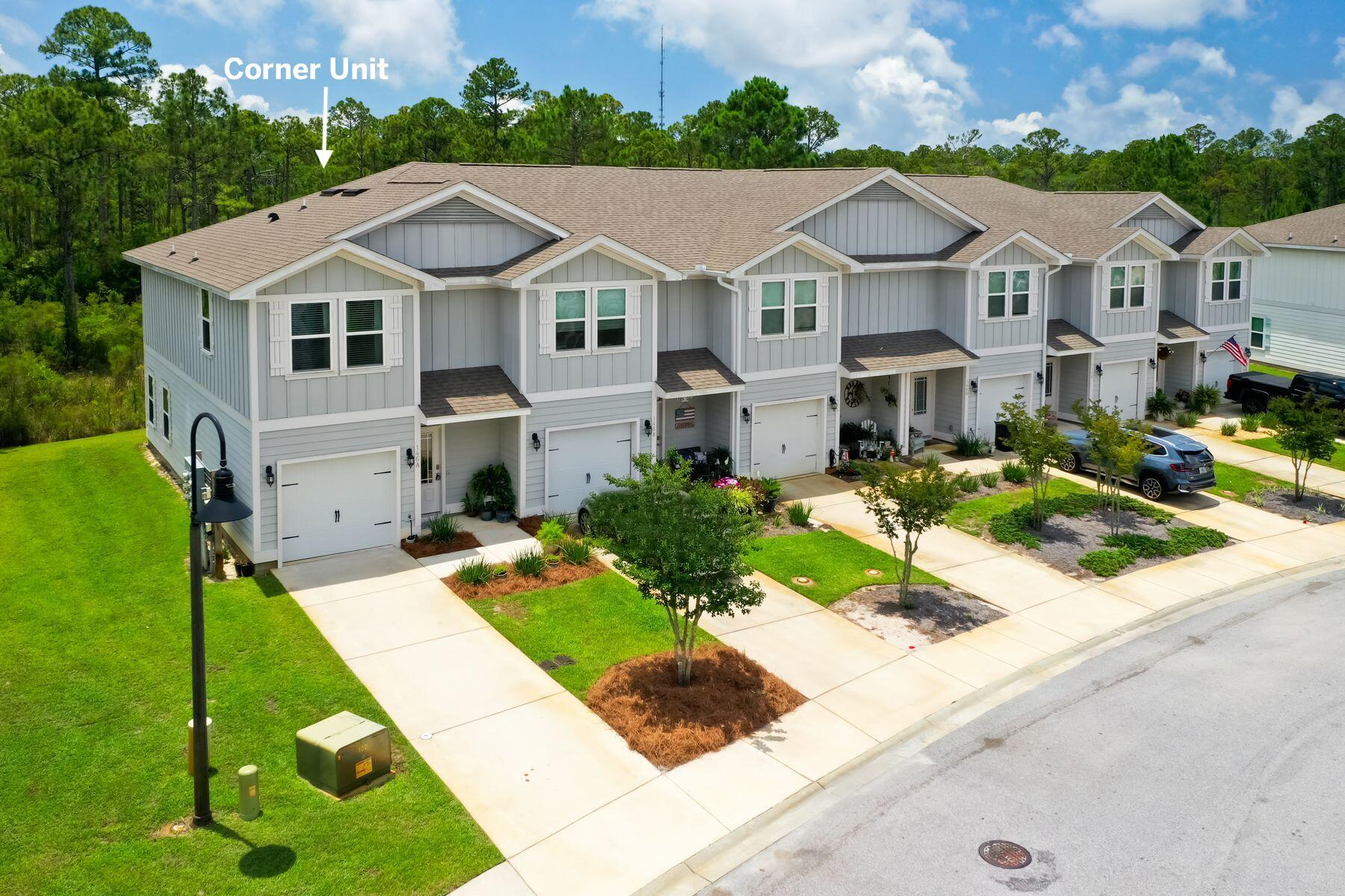 a aerial view of a house with a yard