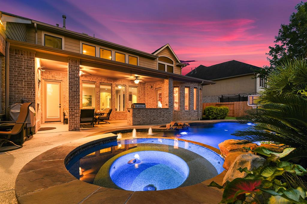 a view of swimming pool with outdoor seating