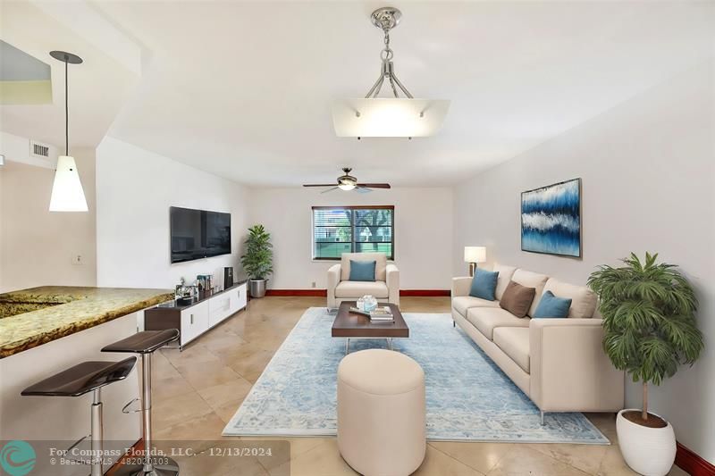 a living room with furniture or couch and a flat screen tv