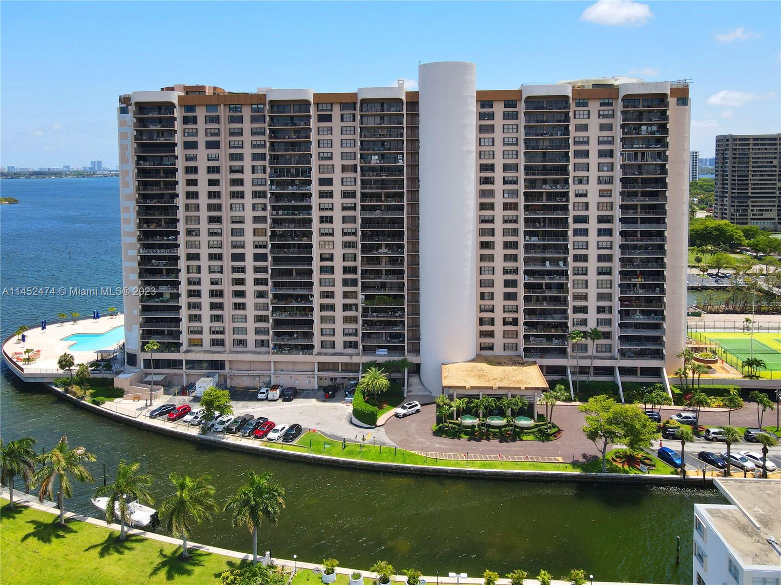 a front view of a building with swimming pool and outdoor space