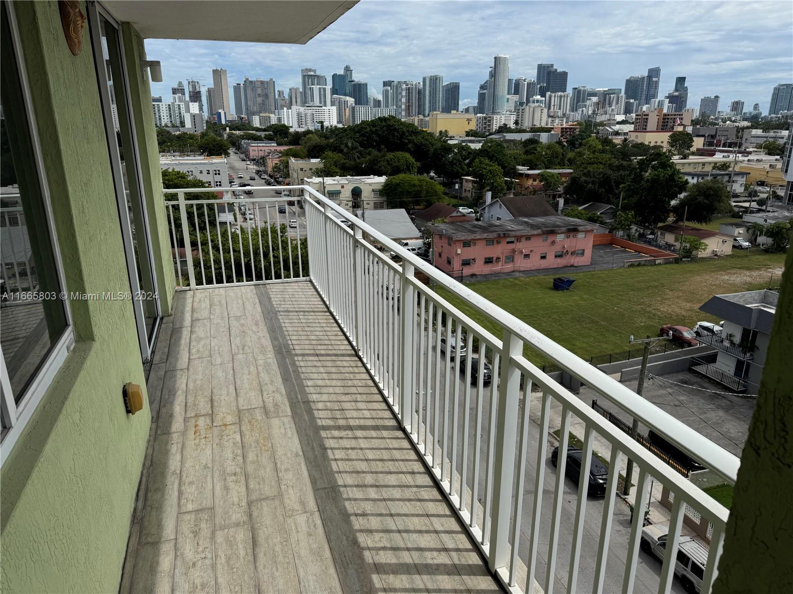 a view of a balcony with city view