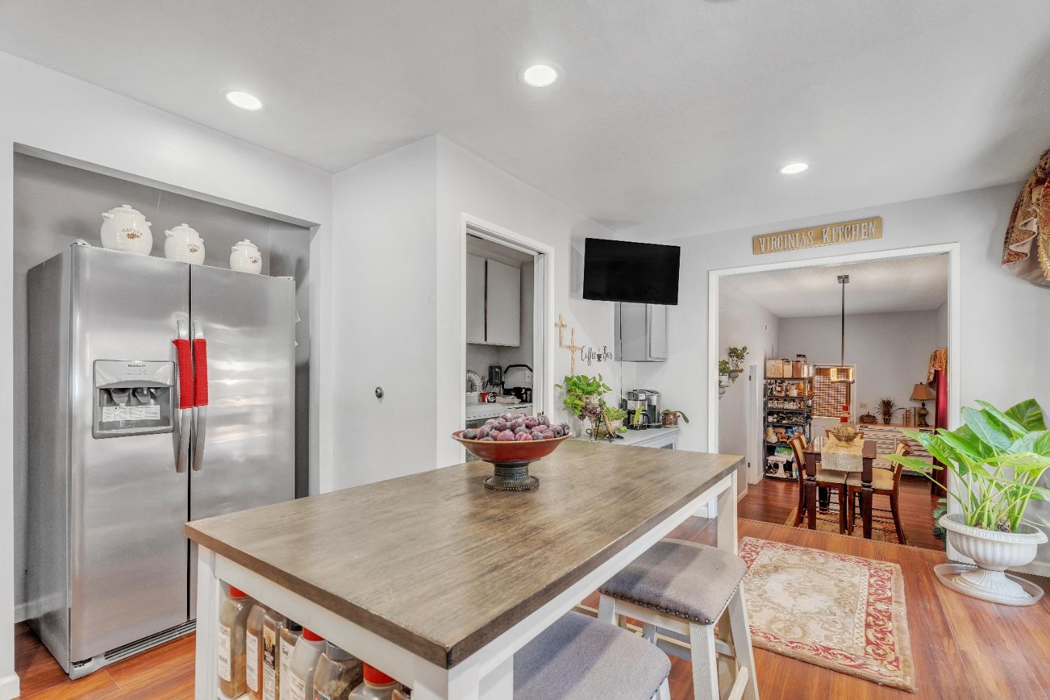 wooden floor with dining table and chairs