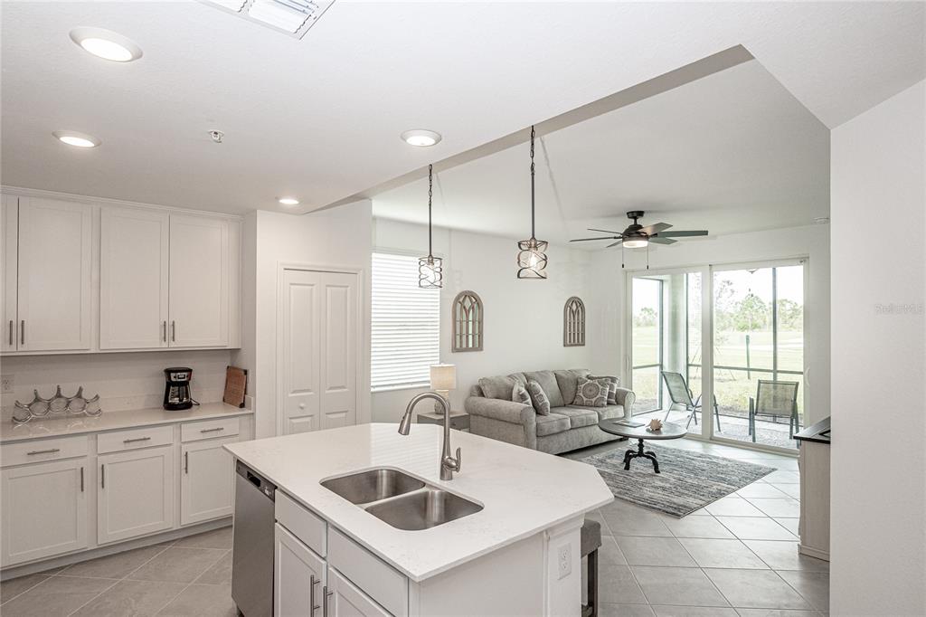 a kitchen with a sink stove and cabinets