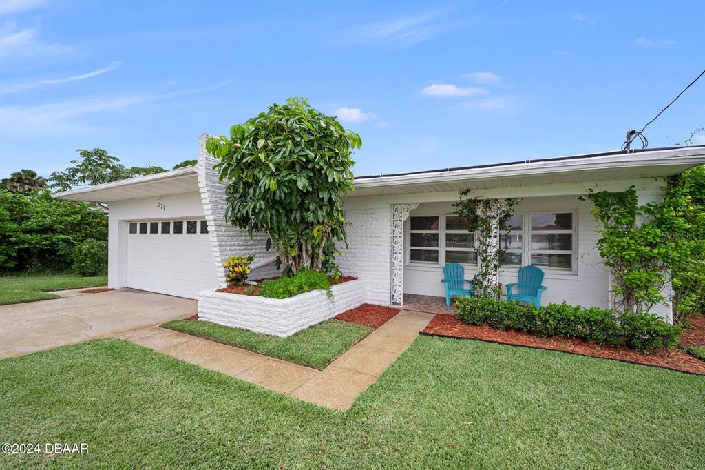 front view of a house with a yard