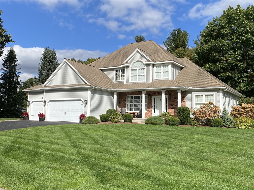 a front view of a house with a yard