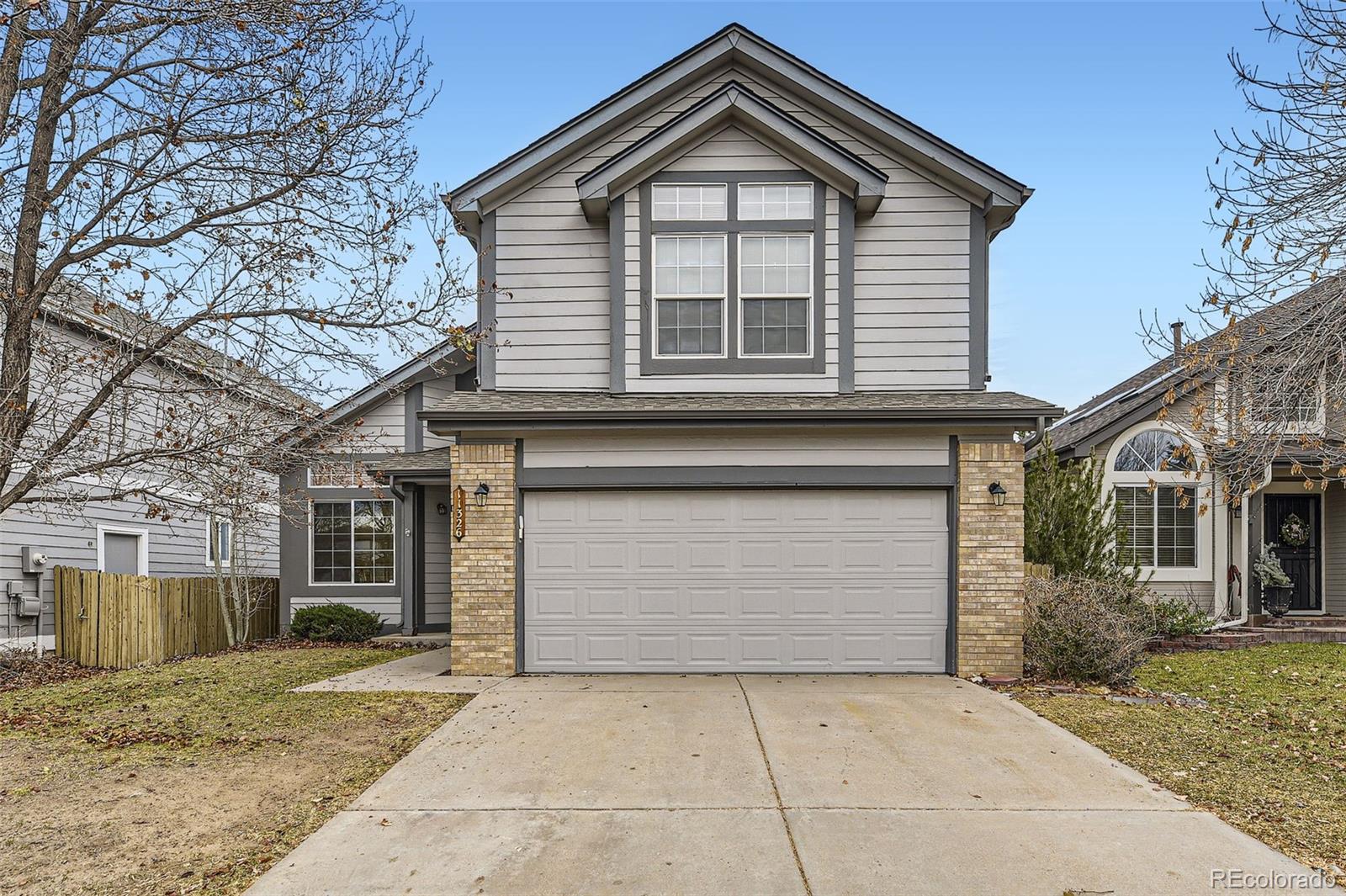 a front view of a house with a garage