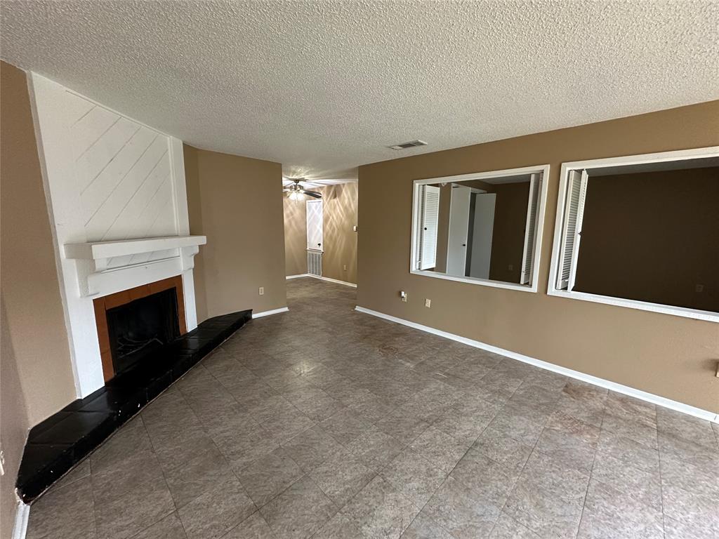 a view of livingroom with fireplace and furniture