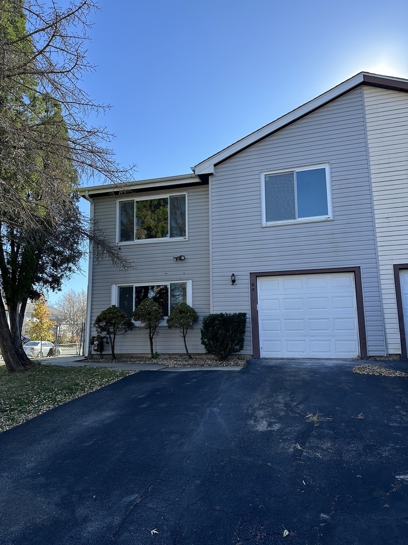 a view of house with yard