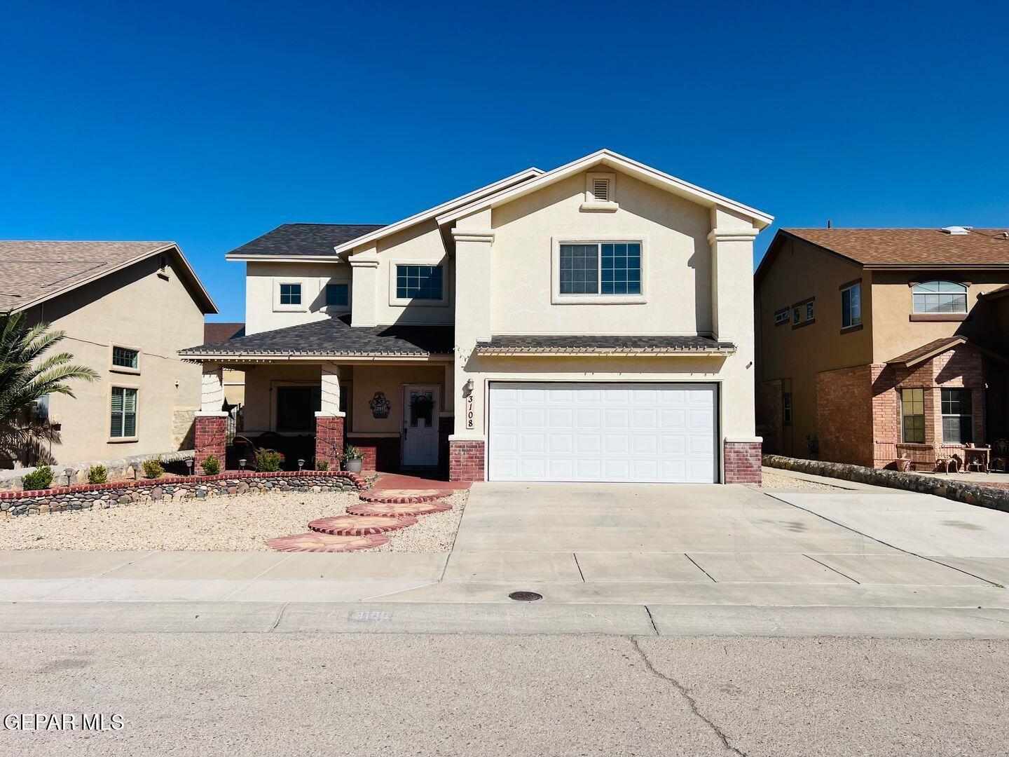 a front view of a house with a patio