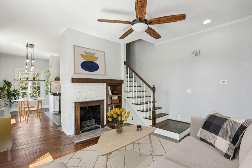 a living room with furniture and a fireplace