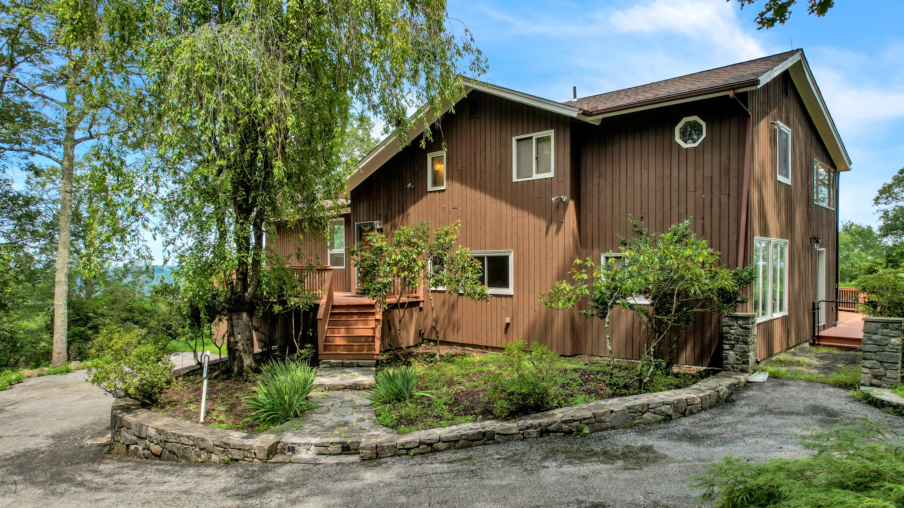 a front view of a house with garden