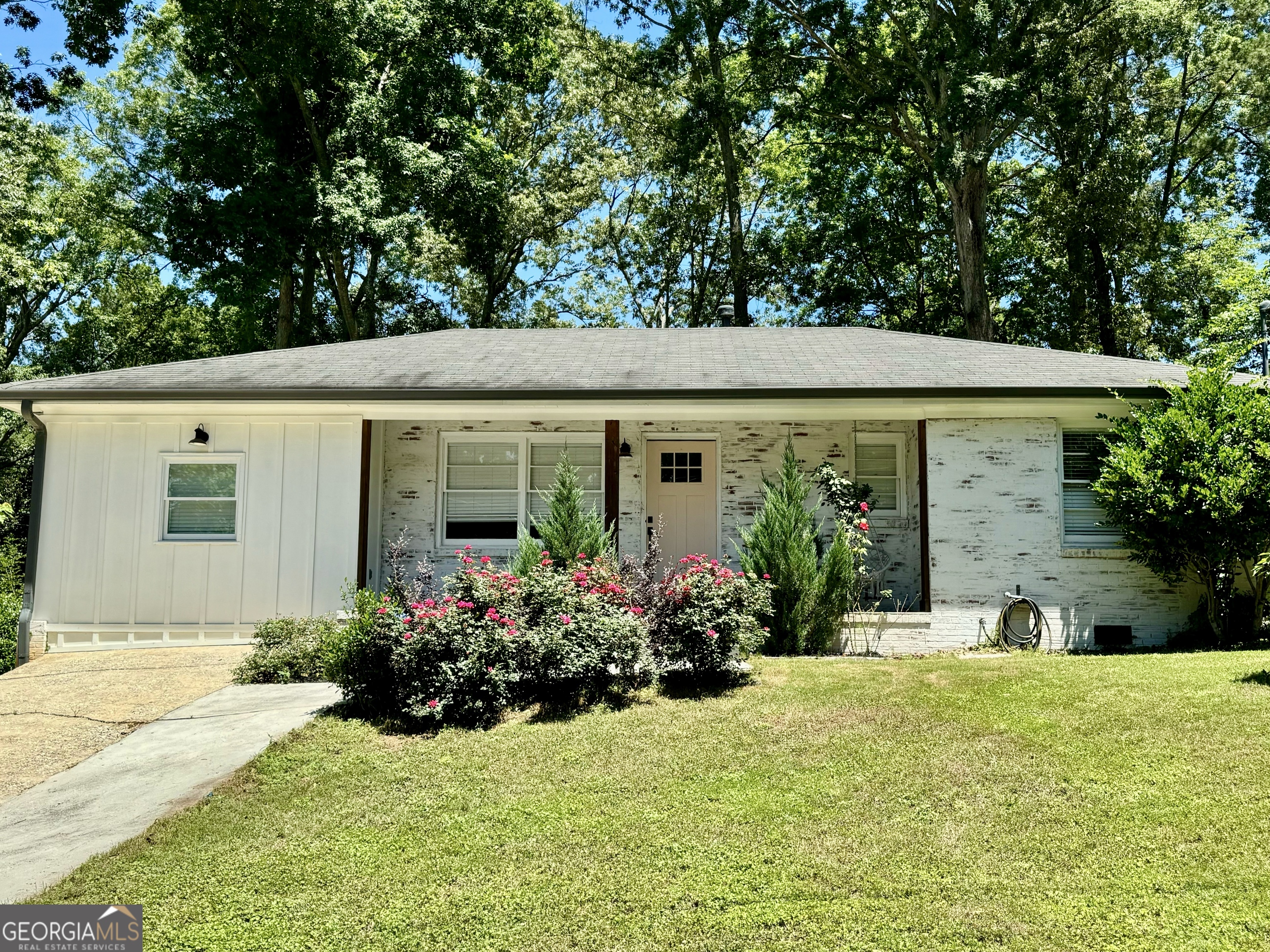 front view of a house with a yard