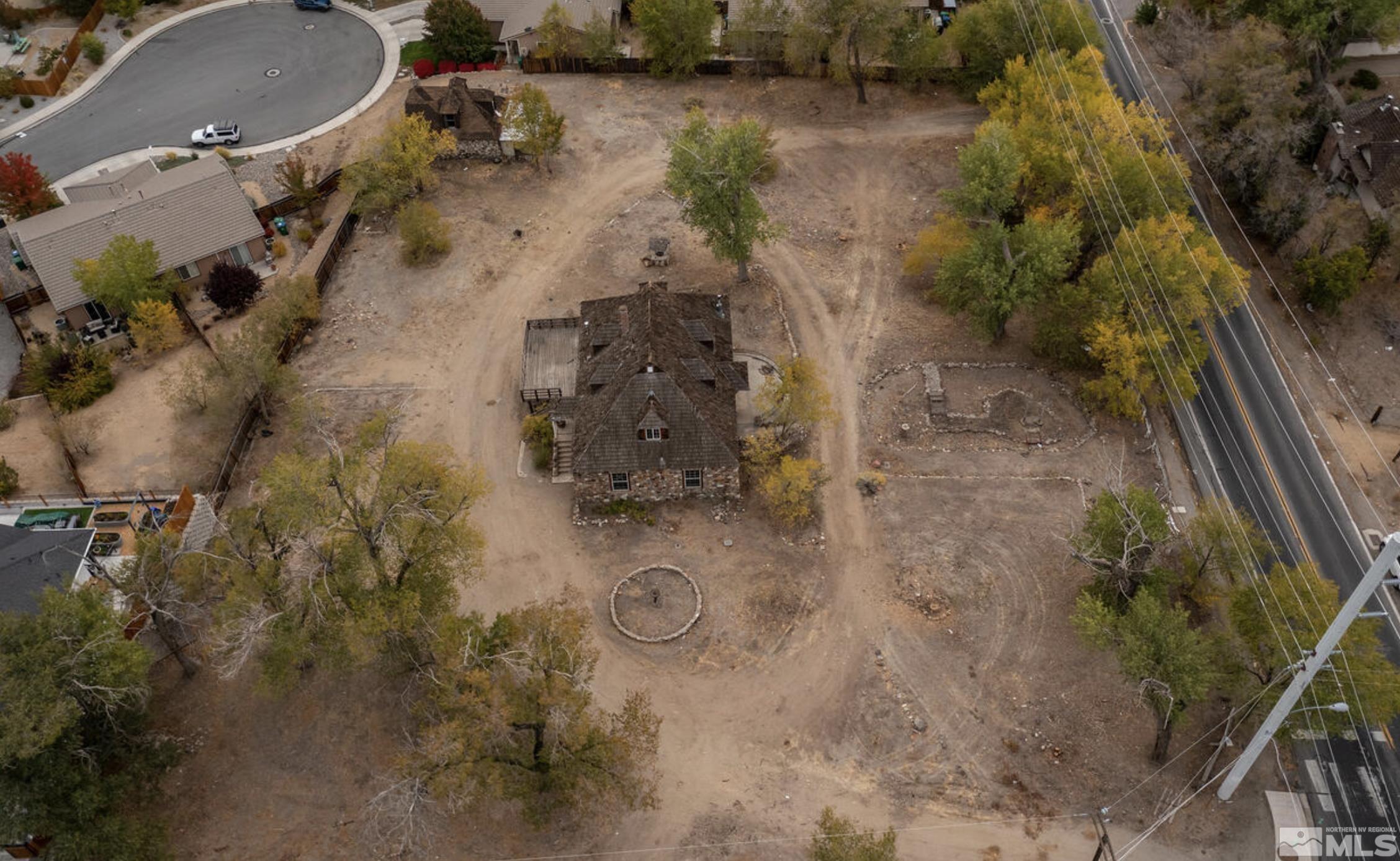 an aerial view of residential houses with outdoor space