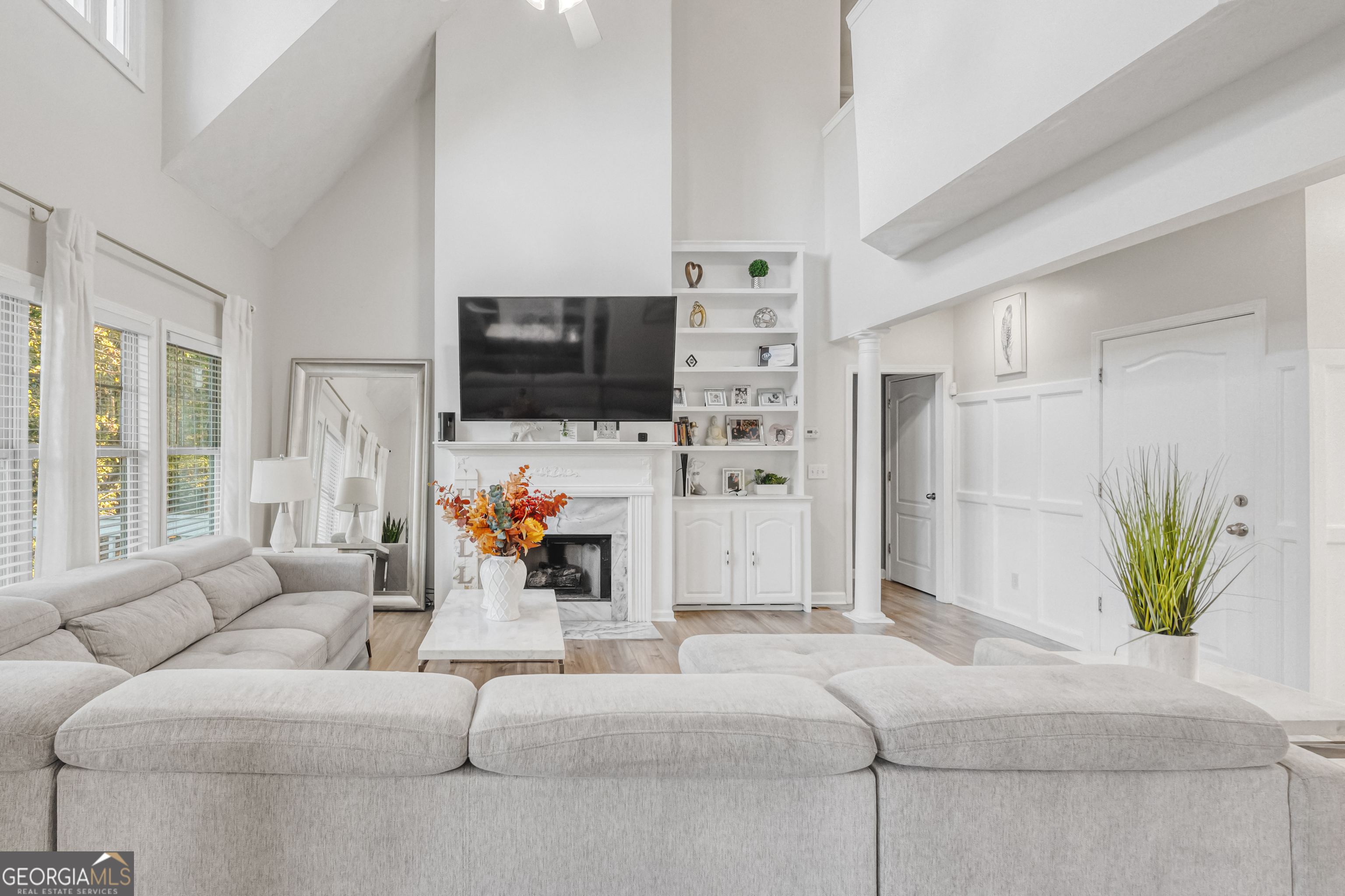 a living room with furniture and a flat screen tv