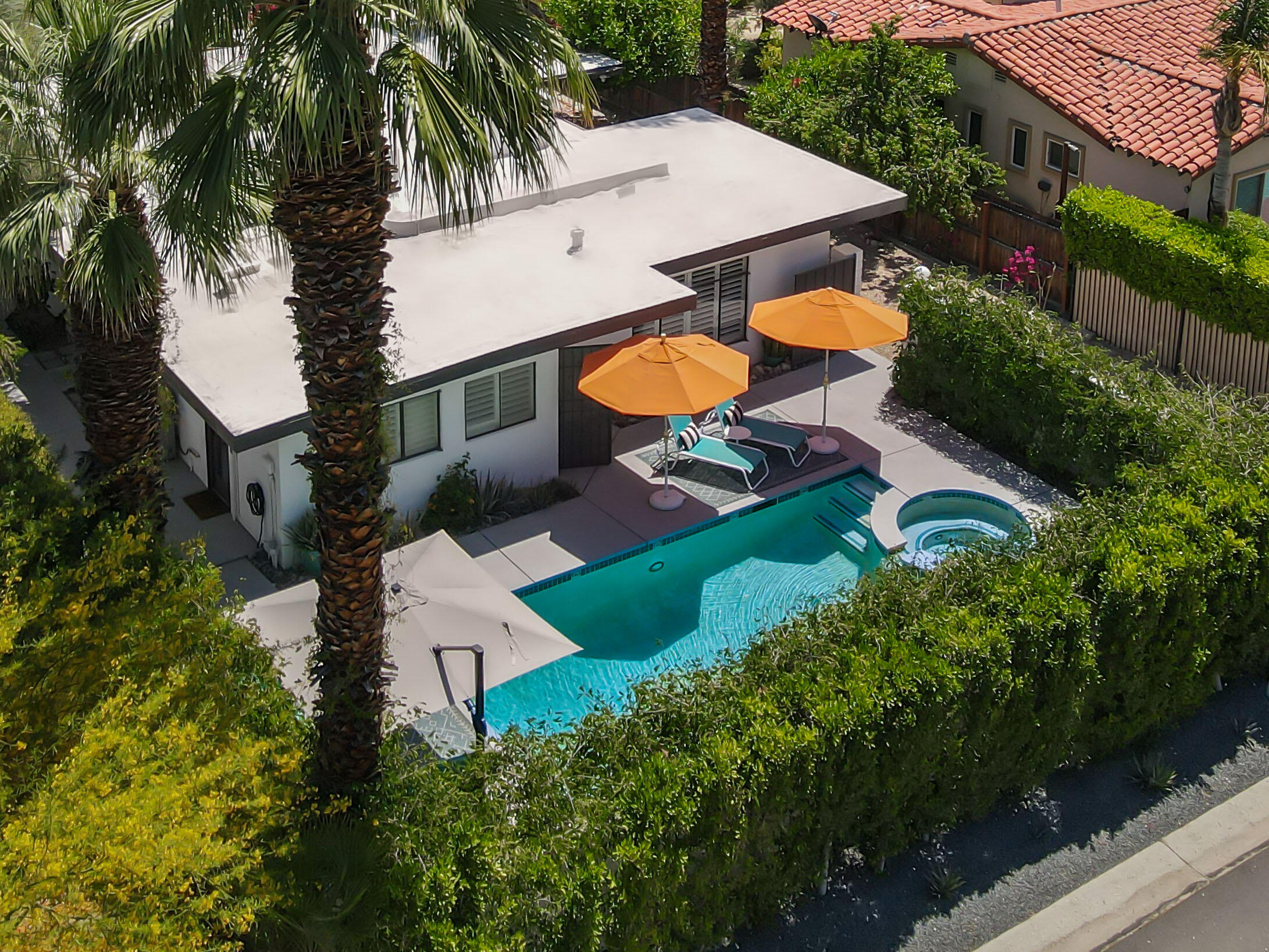 an aerial view of multiple houses with yard