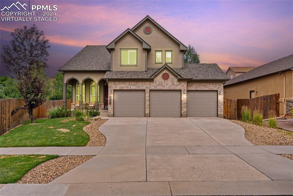 a front view of a house with yard