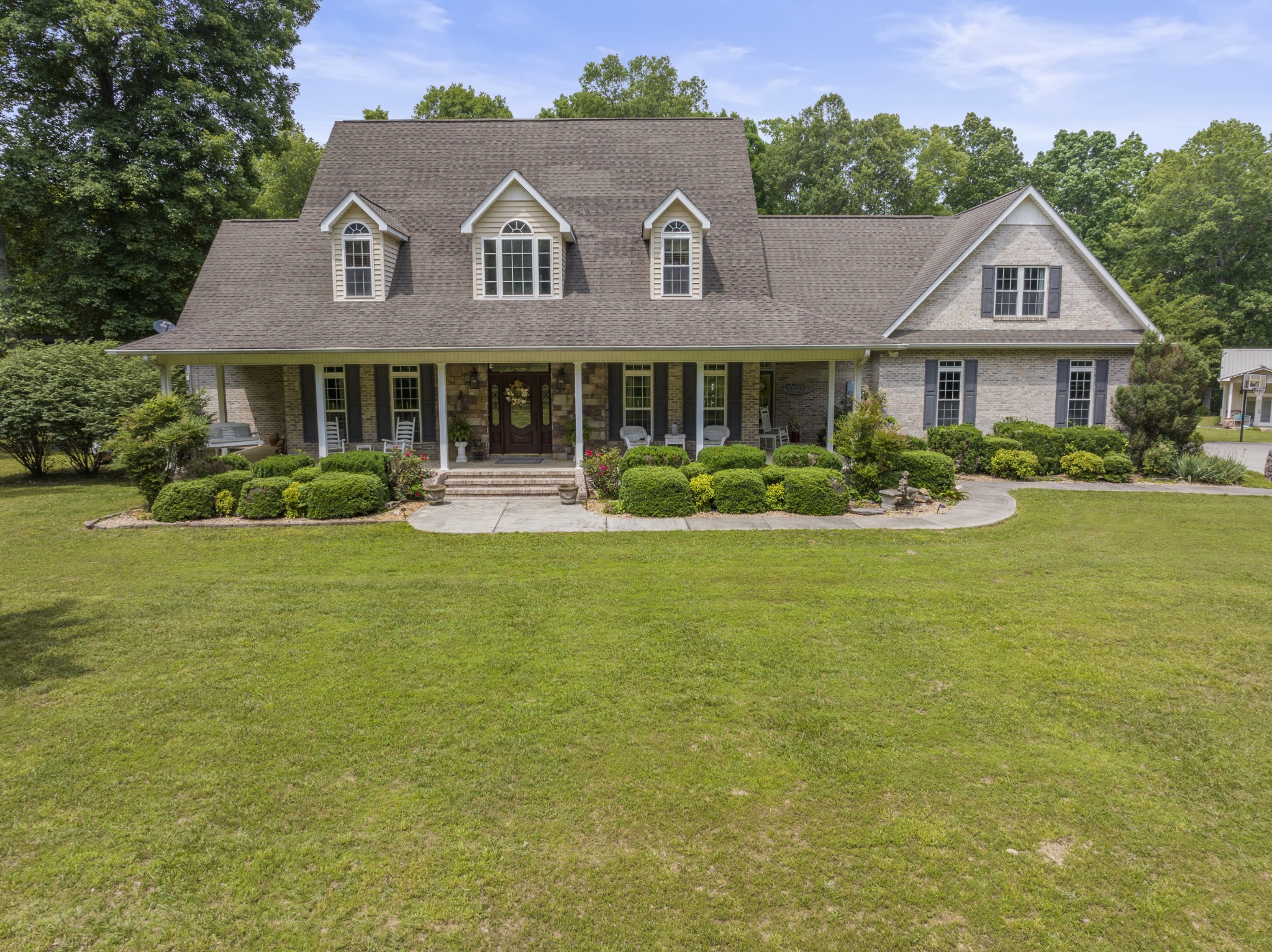 a front view of a house with garden