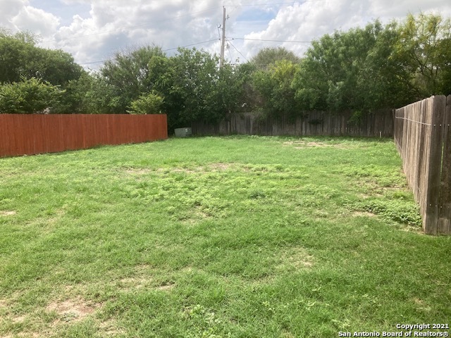 a view of outdoor space and a yard