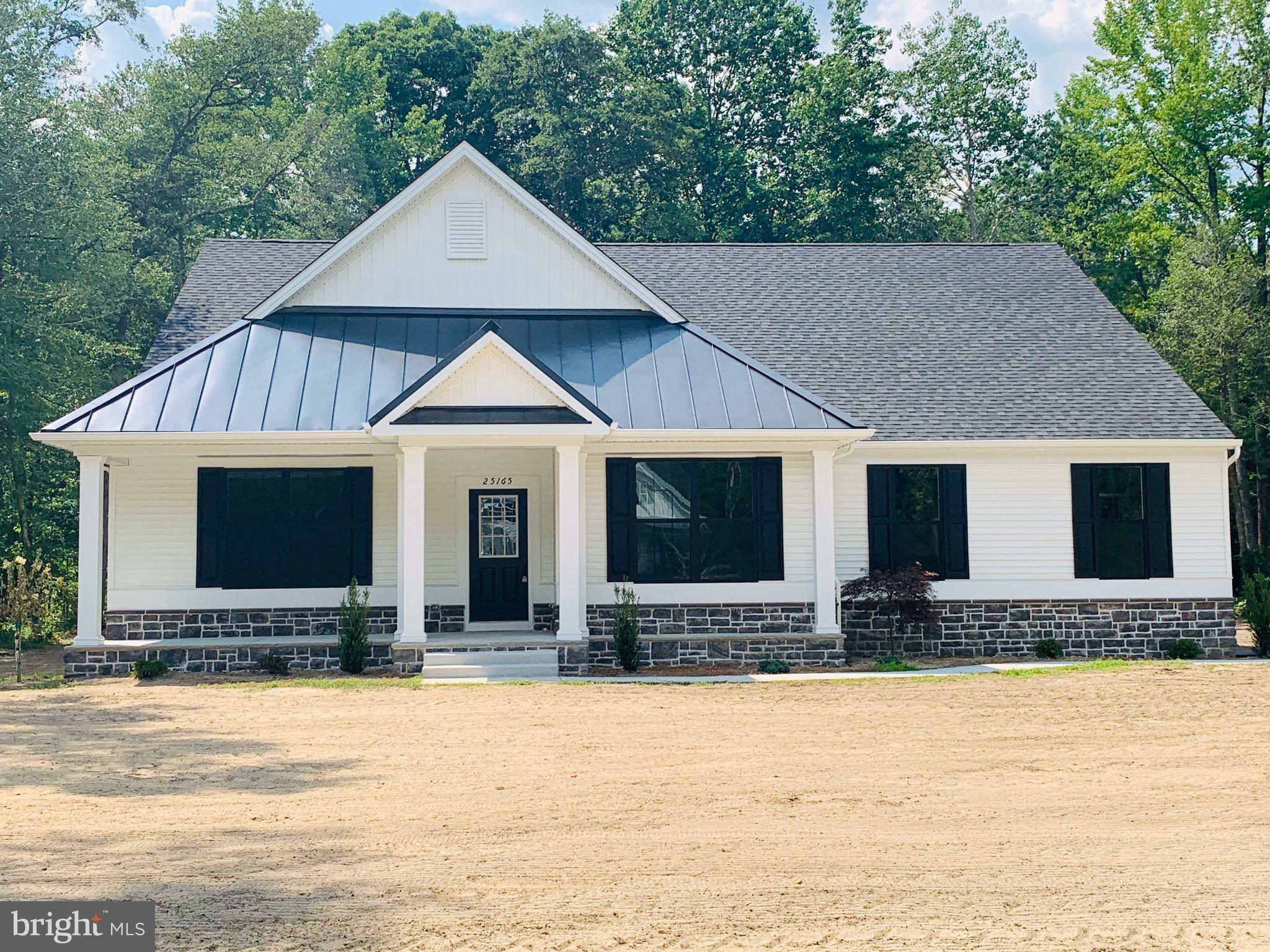 a front view of a house with yard