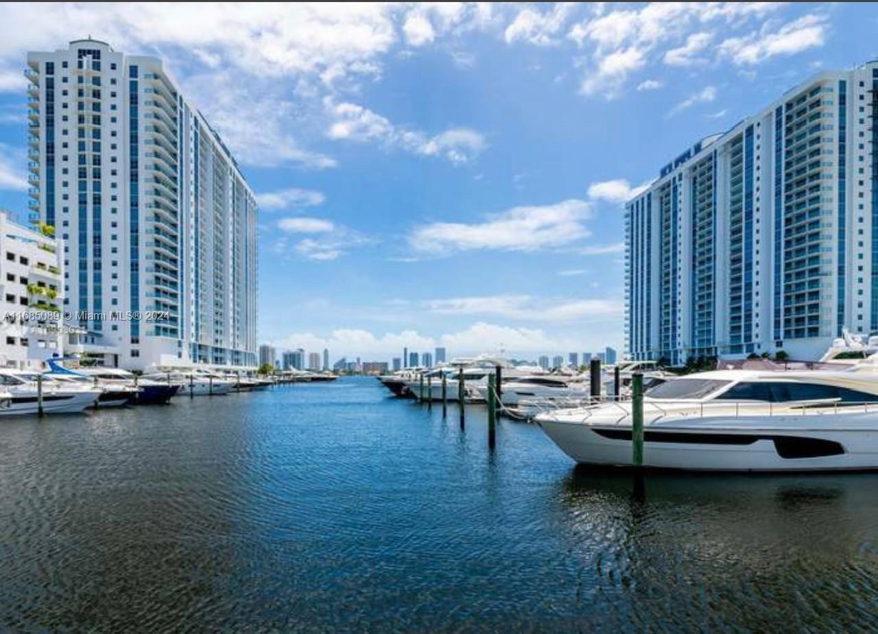 a view of a lake with tall buildings