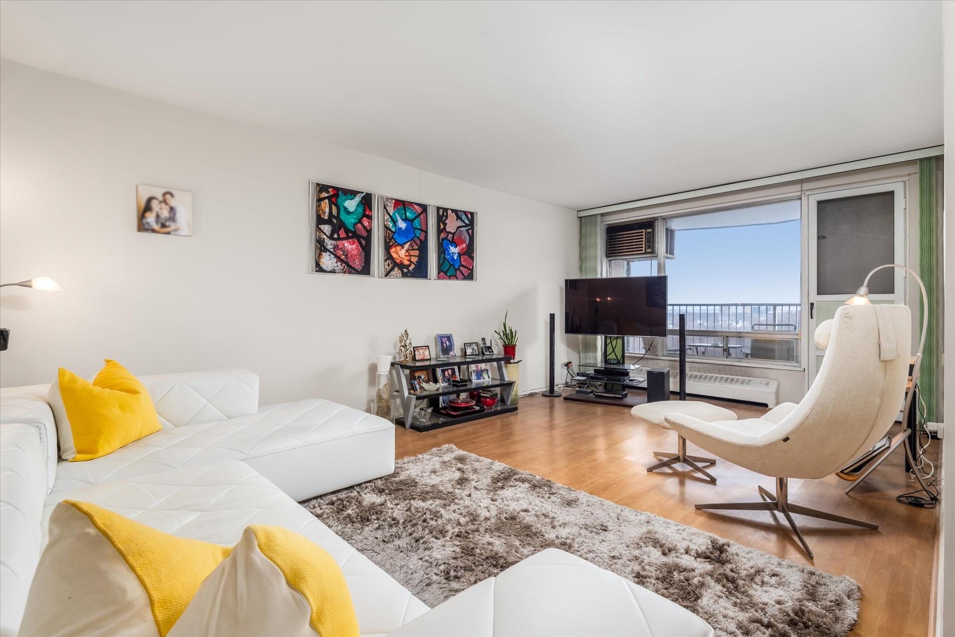 Living room with hardwood / wood-style flooring