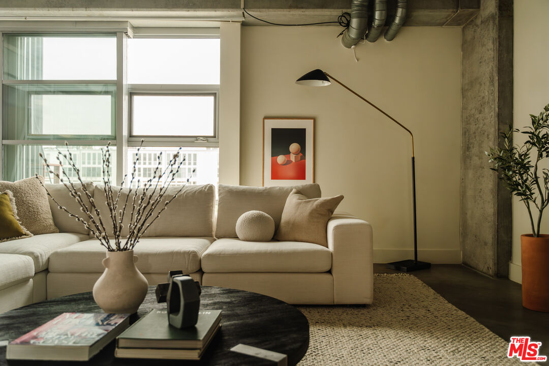 a living room with furniture and a window