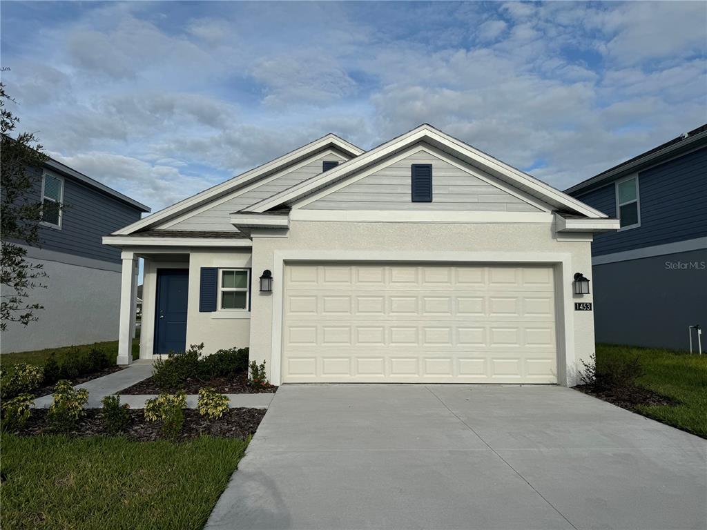 a view of garage and yard