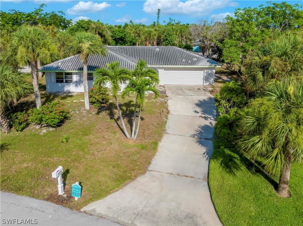 an aerial view of a house with a garden