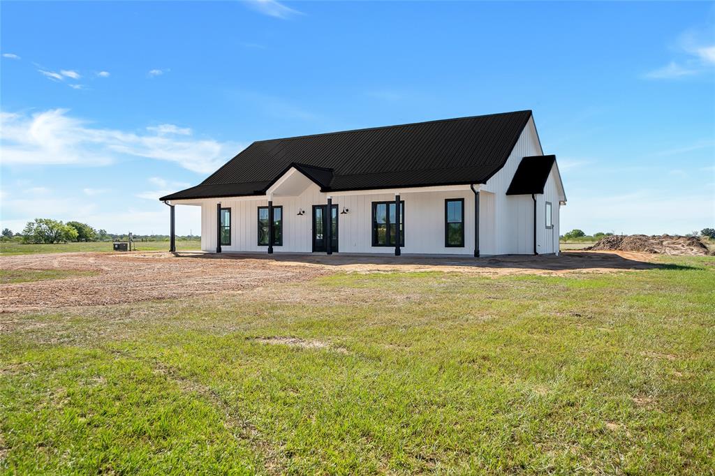 a house with swimming pool in front of it