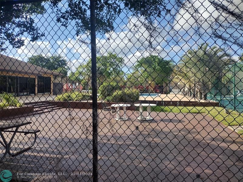 a view of a yard and a fence