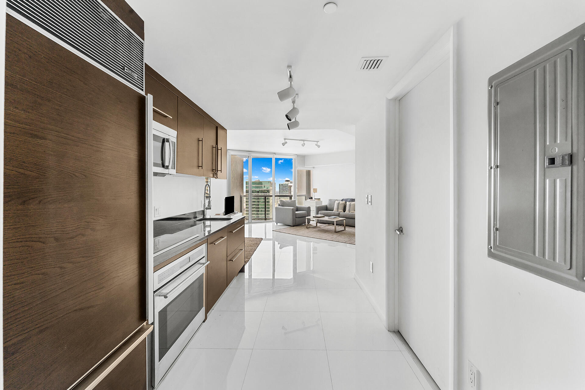 a kitchen with refrigerator and cabinets