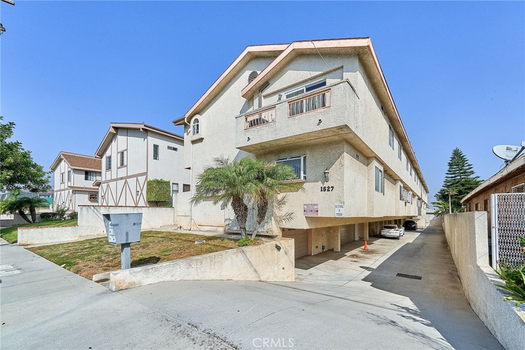 a view of a house with a street