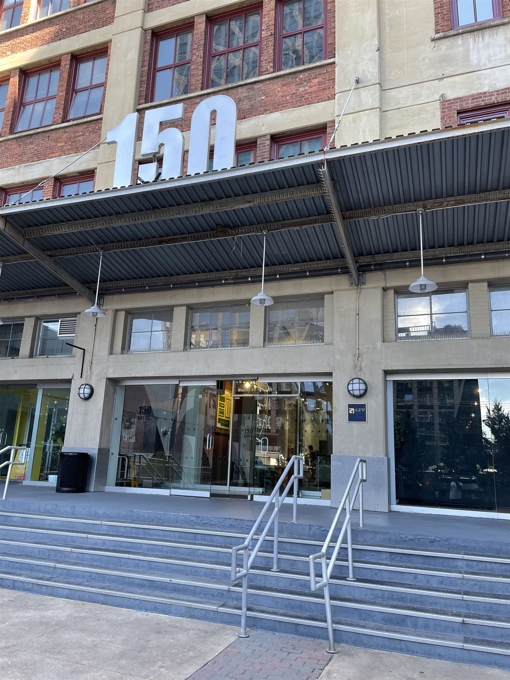 a view of a building with car parked